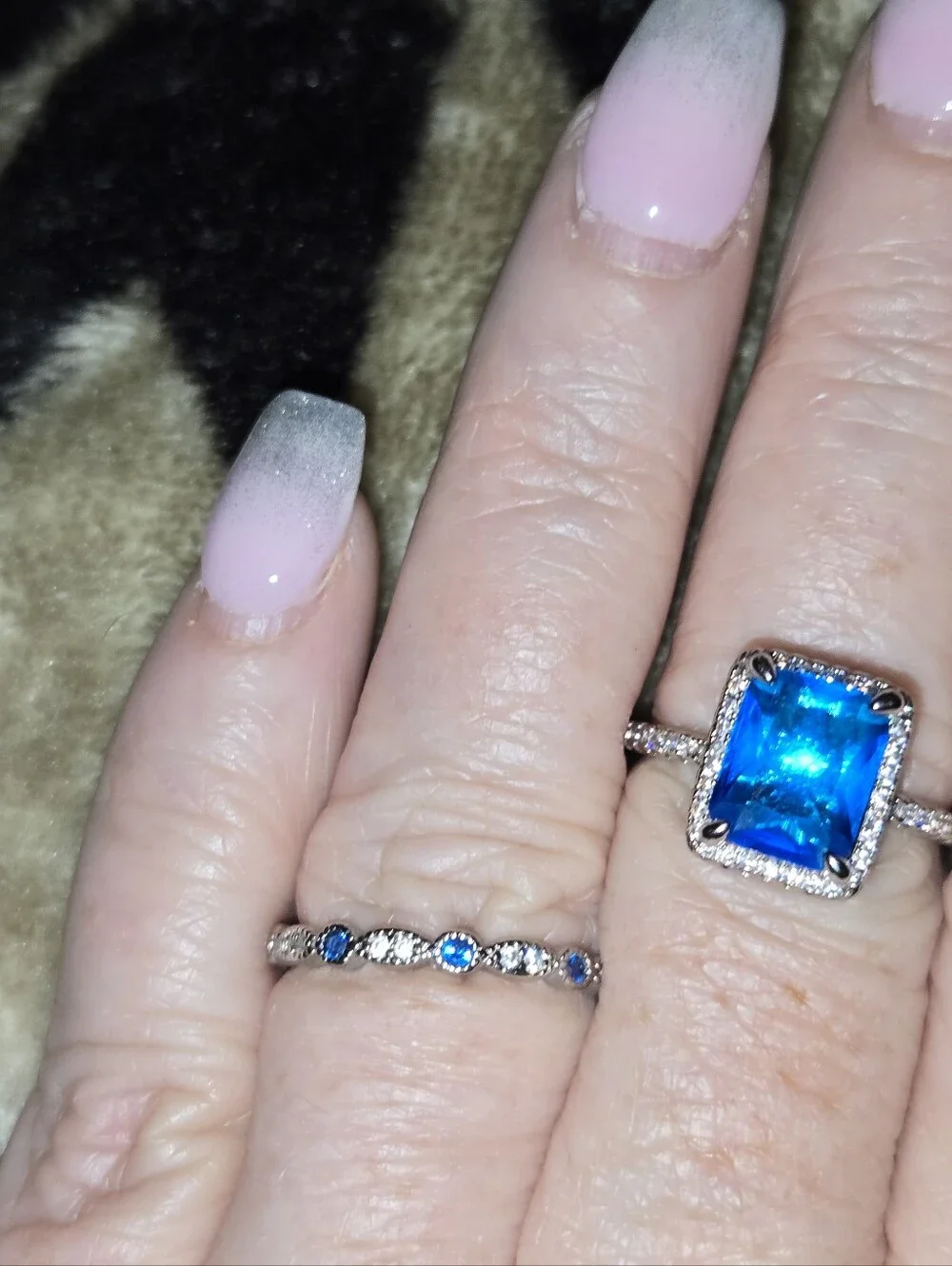 Blue Emerald-Cut Halo Ring with Accent Stones